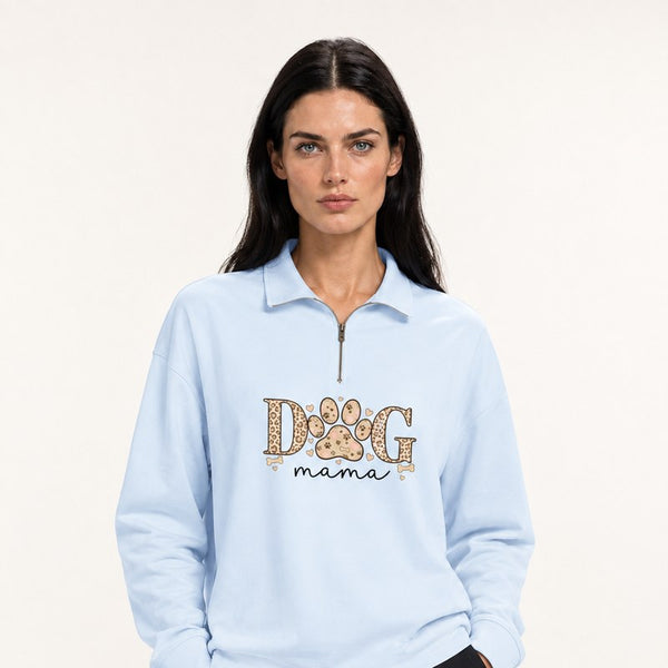 A model wearing a light blue Dog Mama leopard paw quarter-zip sweatshirt.