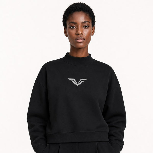 A model wearing a black GALOVTE mock-neck crewneck sweatshirt.