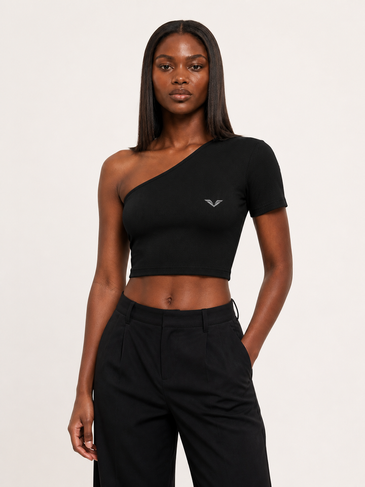 Model wearing black ribbed one-shoulder crop top, carrying the GALOVTE winged chevron logo.