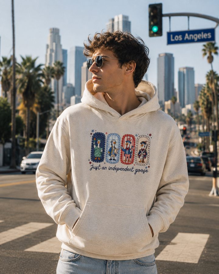 Just An Independent Goose Fourth of July Hoodie in Oat Gray, worn on a Los Angeles street.