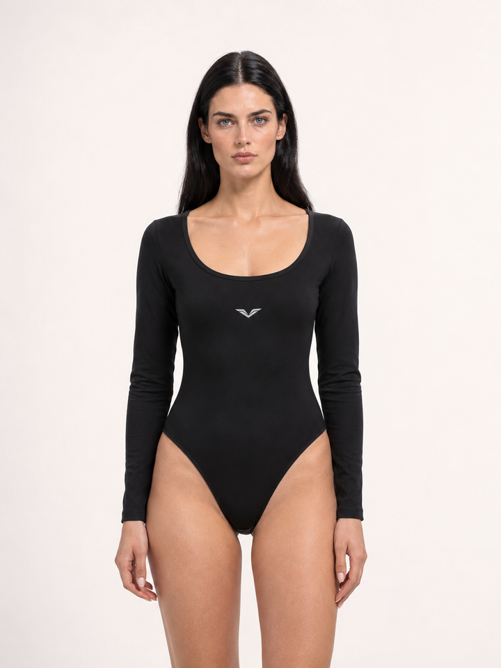 Model wearing black long-sleeve scoop-neck yoga bodysuit, carrying the GALOVTE winged chevron logo.