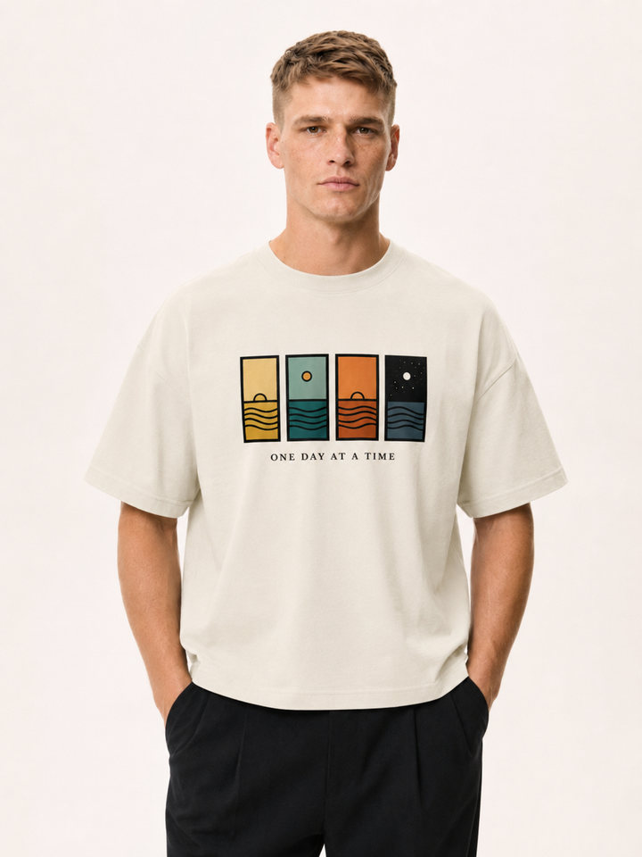One Day At A Time Mid-Century Sunset Panel Tee in cream, worn by a model.