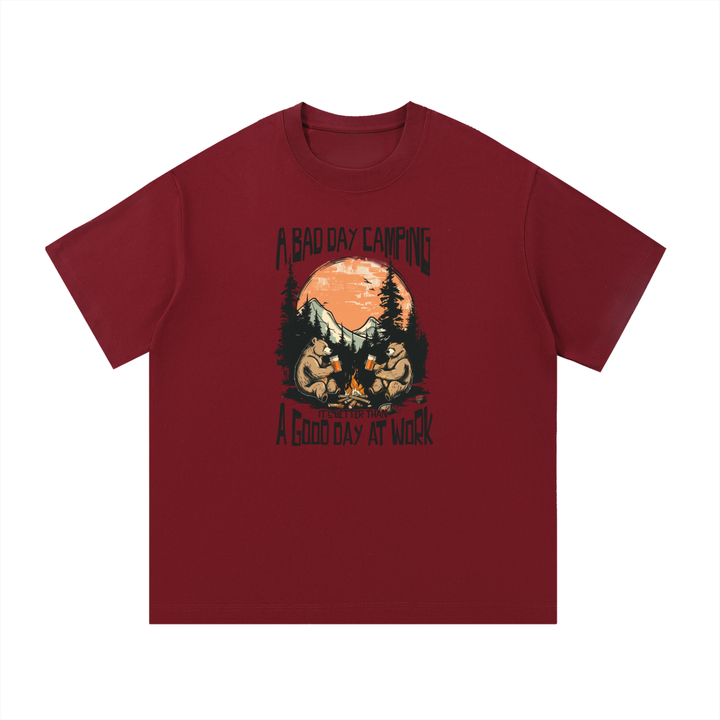 A Bad Day Camping Beats A Good Day At Work Tee in Wine Red, flat lay.