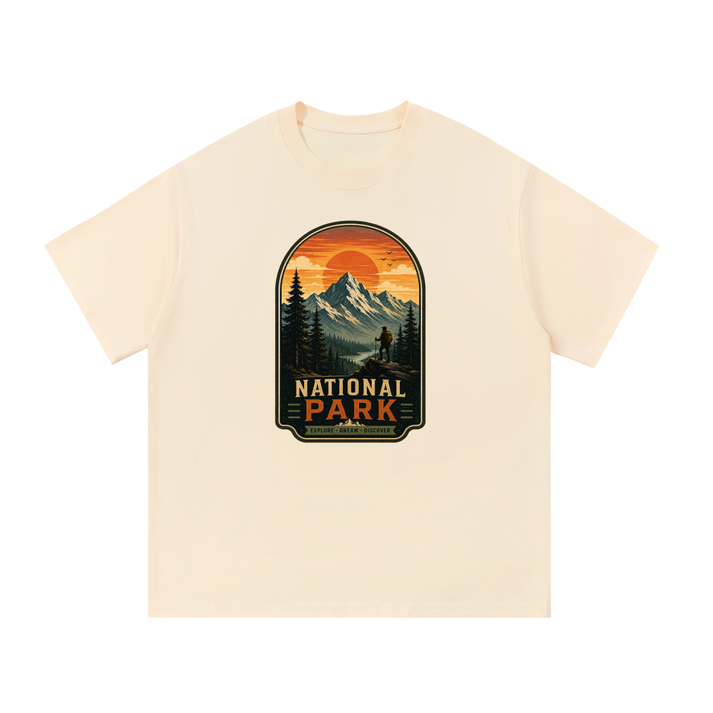 National Park Explore Dream Discover Badge Tee in Apricot, flat lay.