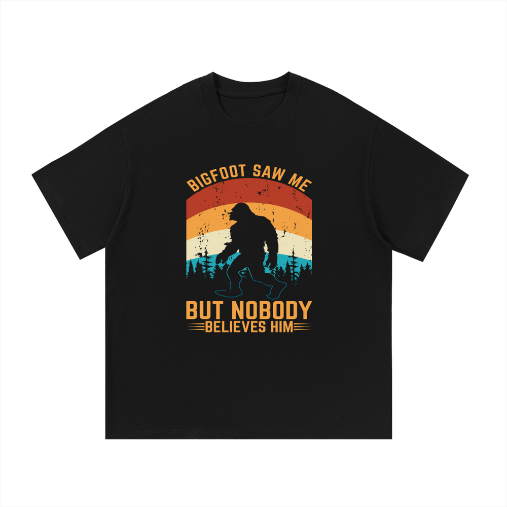 Bigfoot Saw Me But Nobody Believes Him Retro Tee in Black, flat lay.