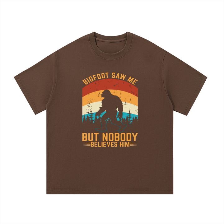 Bigfoot Saw Me But Nobody Believes Him Retro Tee in Coffee, flat lay.