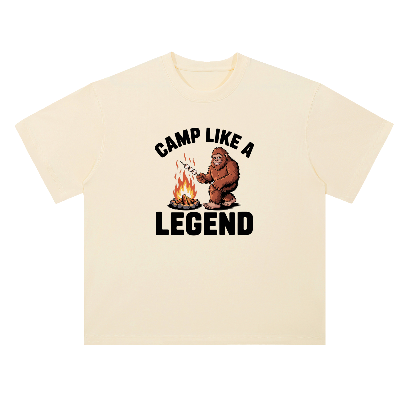 Camp Like A Legend Bigfoot Campfire Tee in Milk Apricot, flat lay.
