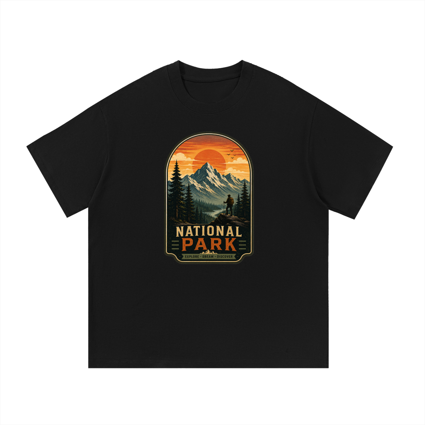 National Park Explore Dream Discover Badge Tee in Black, flat lay.