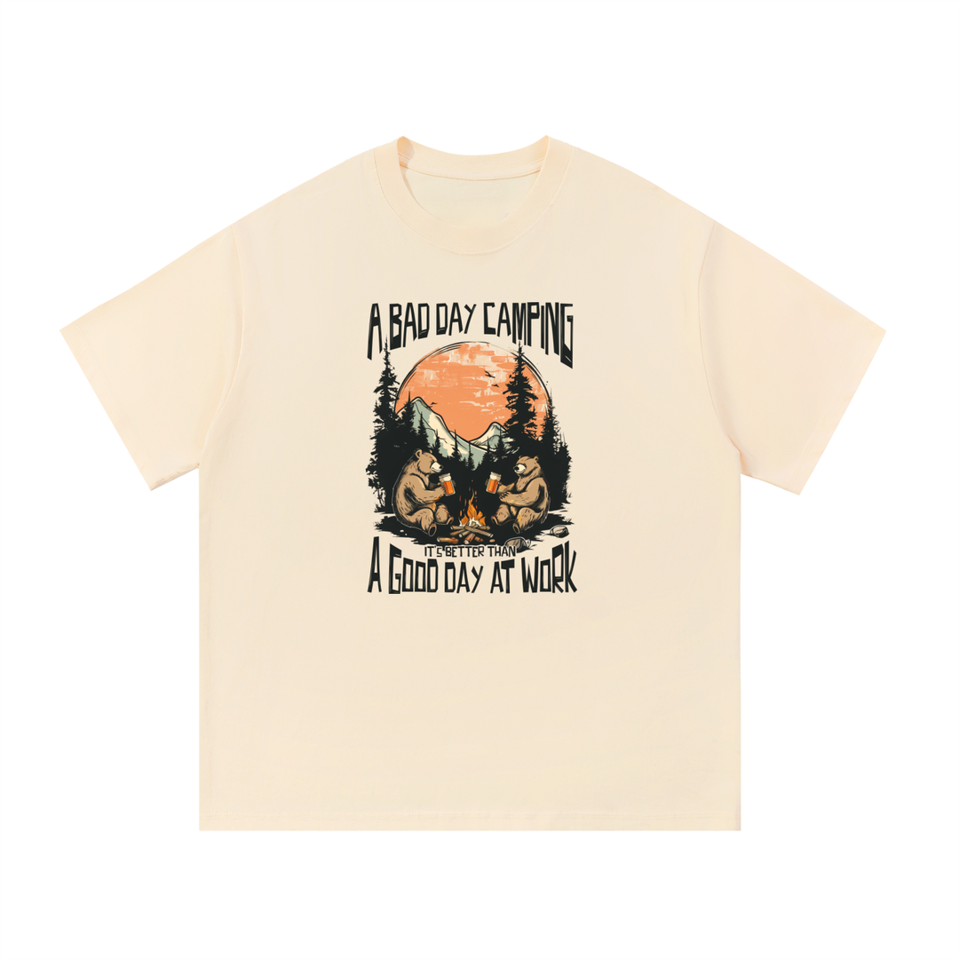 A Bad Day Camping Beats A Good Day At Work Tee in Apricot, flat lay.