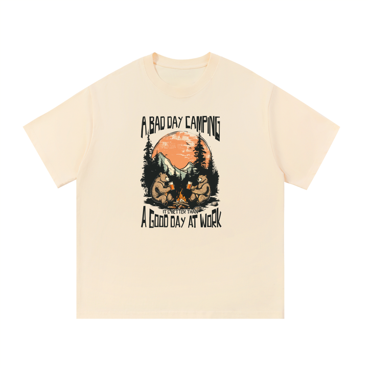 A Bad Day Camping Beats A Good Day At Work Tee in Apricot, flat lay.