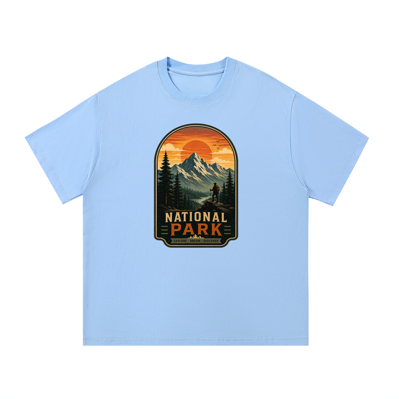 National Park Explore Dream Discover Badge Tee in Blue, flat lay.