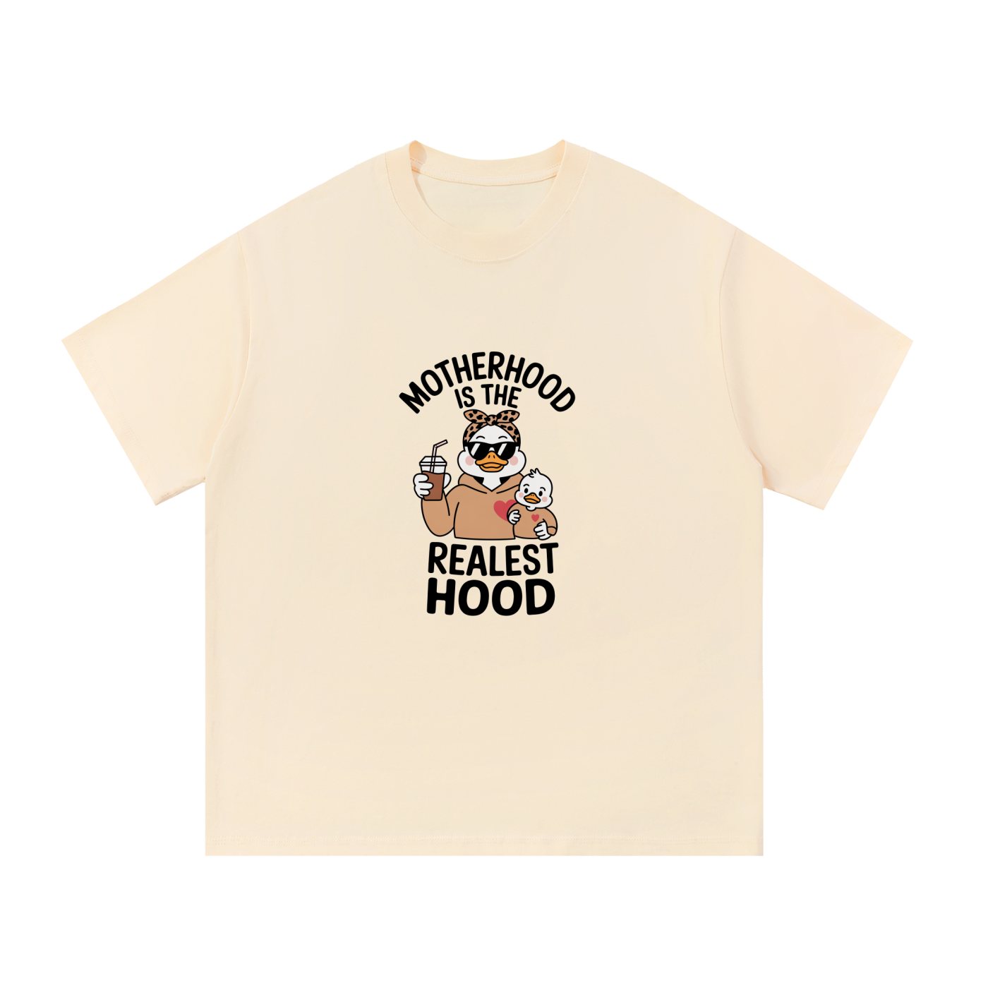 Motherhood Is The Realest Hood Funny Mama Tee in Apricot, flat lay.