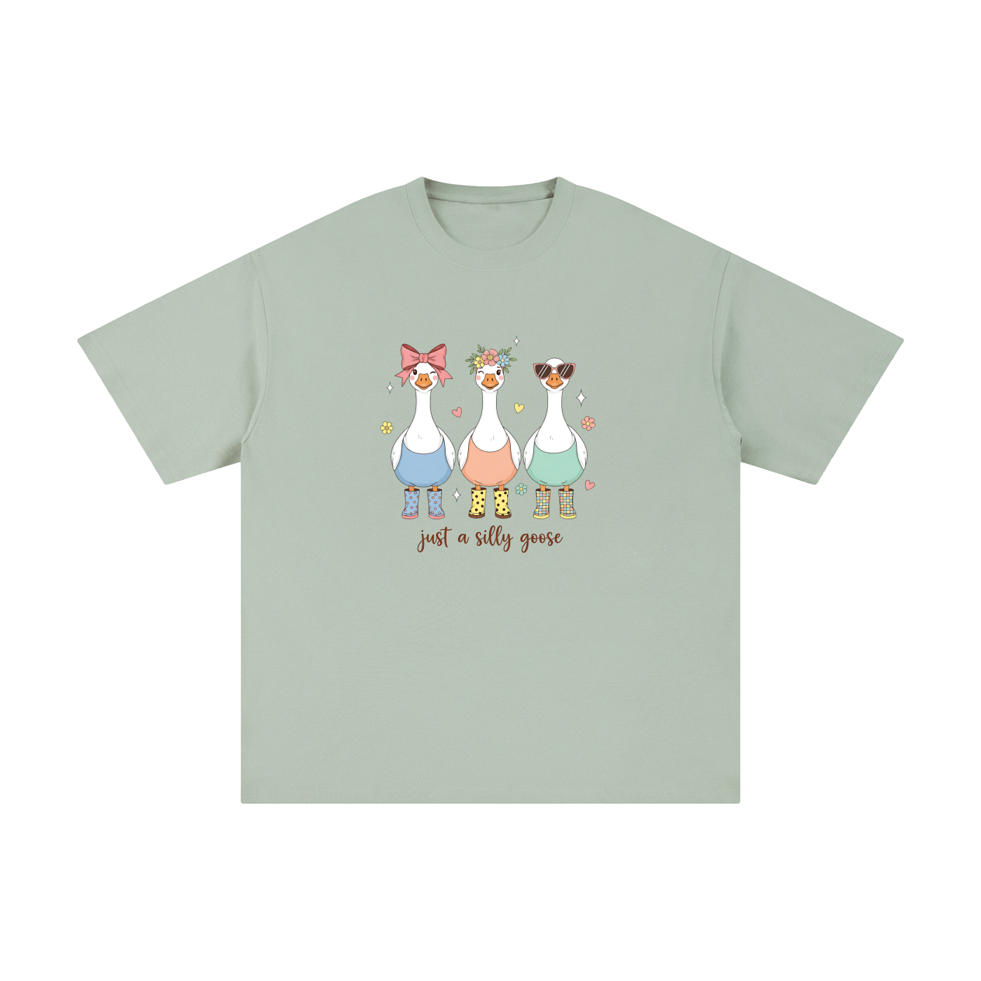 Just A Silly Goose Trio Pastel Cotton Tee in Bean Green, flat lay.