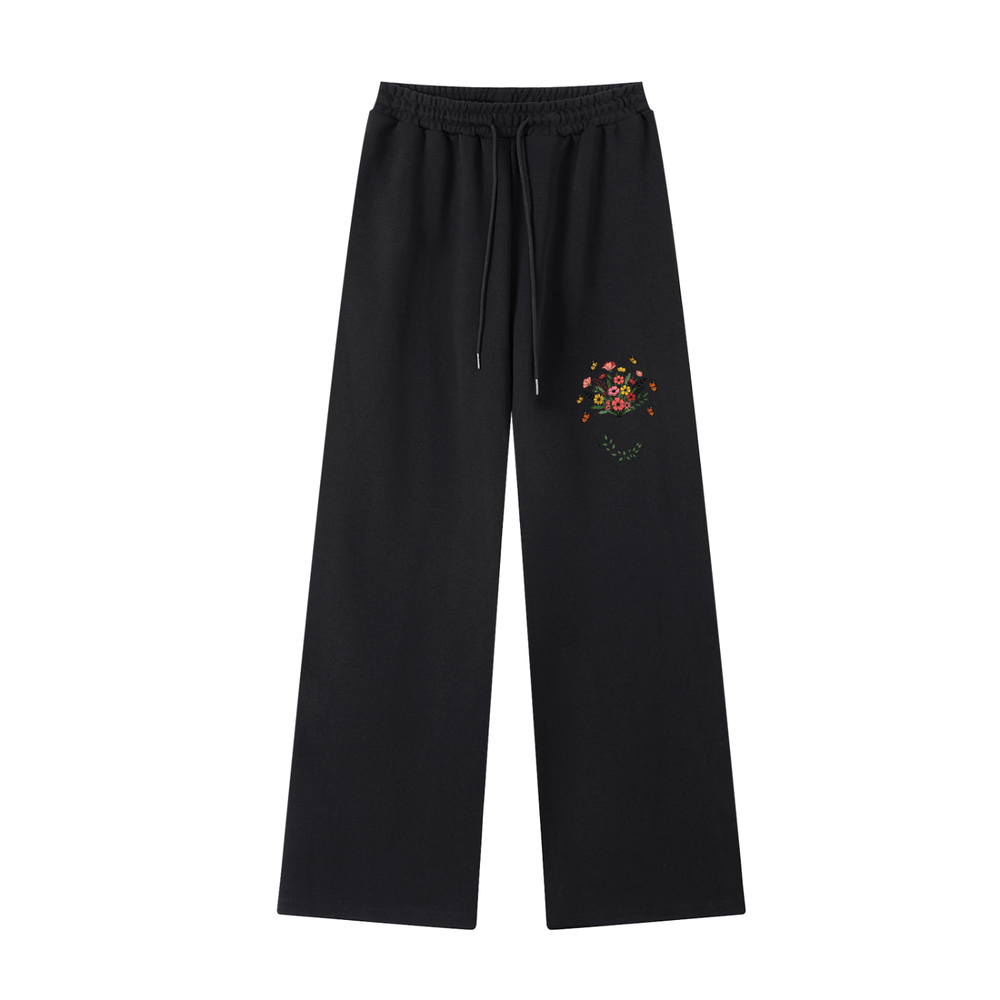 Wildflower Print Straight-Leg Cotton Sweatpants in Black, flat lay.