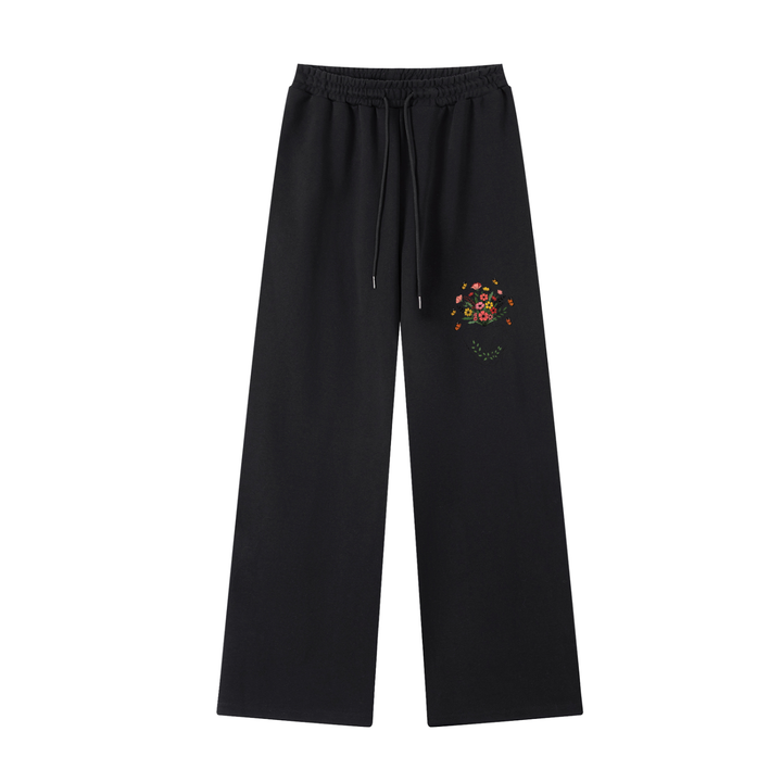 Wildflower Print Straight-Leg Cotton Sweatpants in Black, flat lay.