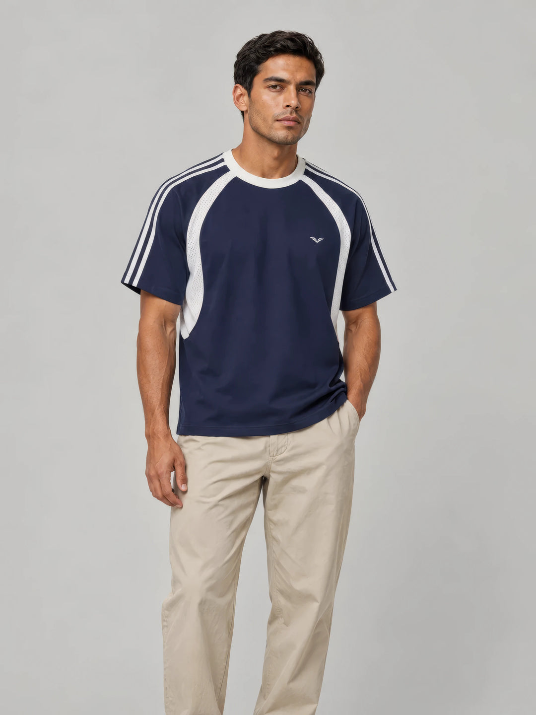 Model in a navy GALOVTE mesh-panel tee with white stripes
