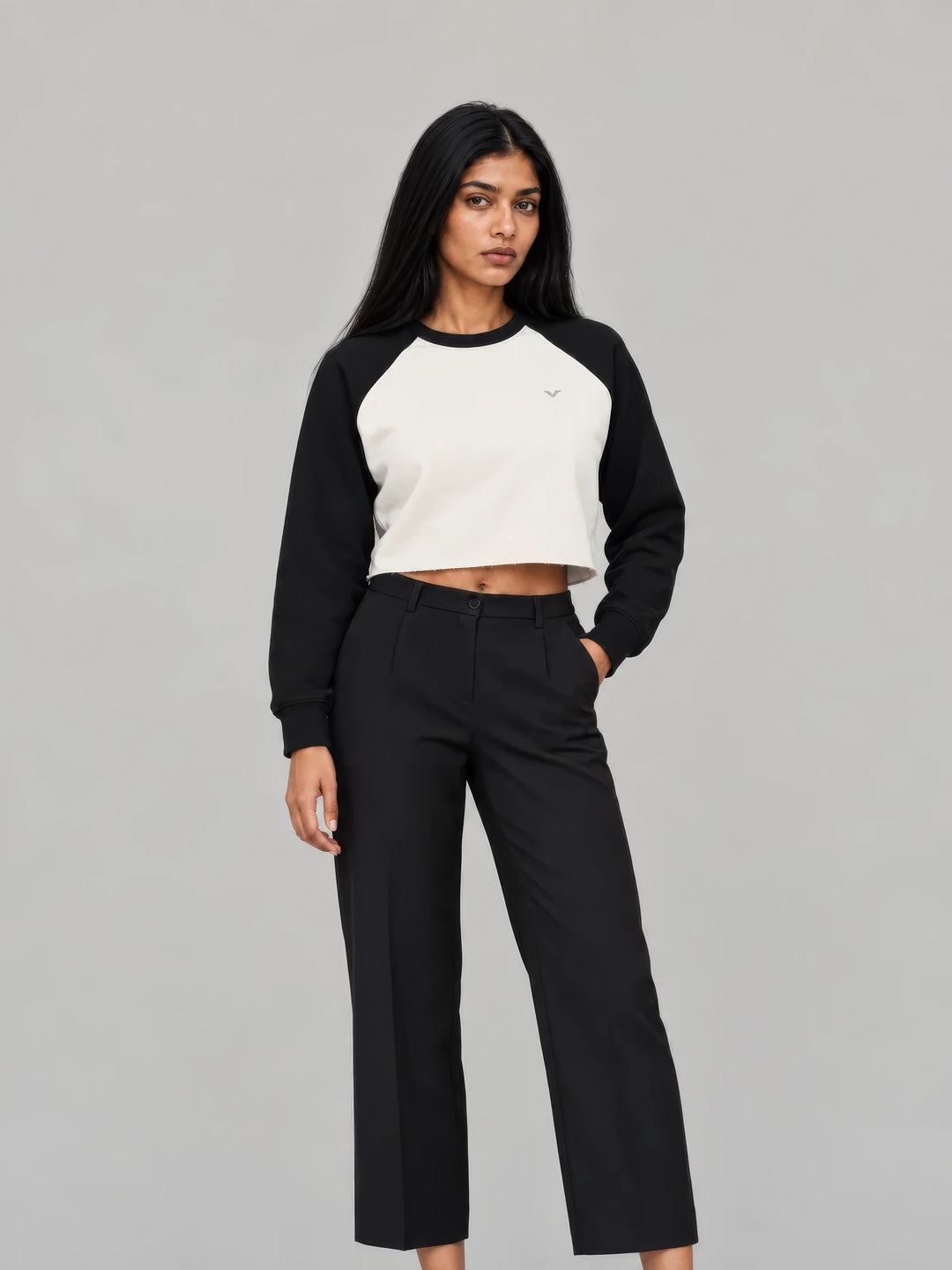 Model in a cream and black GALOVTE cropped raglan sweatshirt