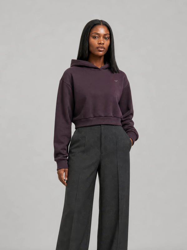 Model in a plum GALOVTE cropped hoodie